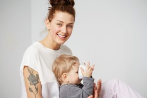 happy-young-mother-with-little-son-home_273609-14808