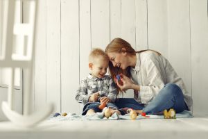 mother-with-son-preparing-easter-home_1157-32933